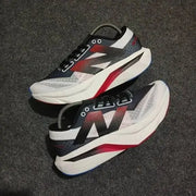 New Balance sc elite white black red